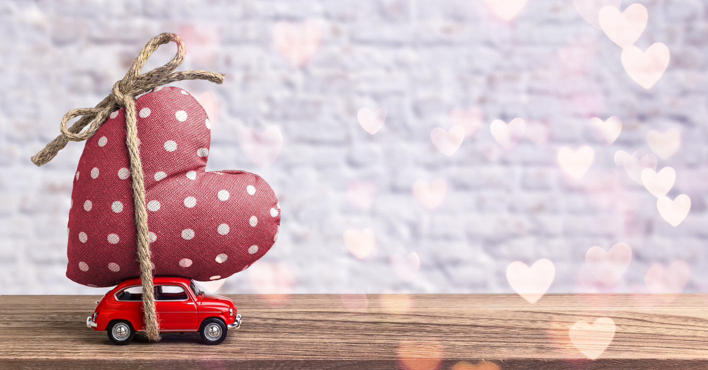Valentines Day Incoming - Miniature Red Car Carrying Heart